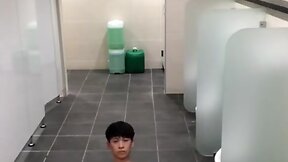 Oriental young jack in public toilet